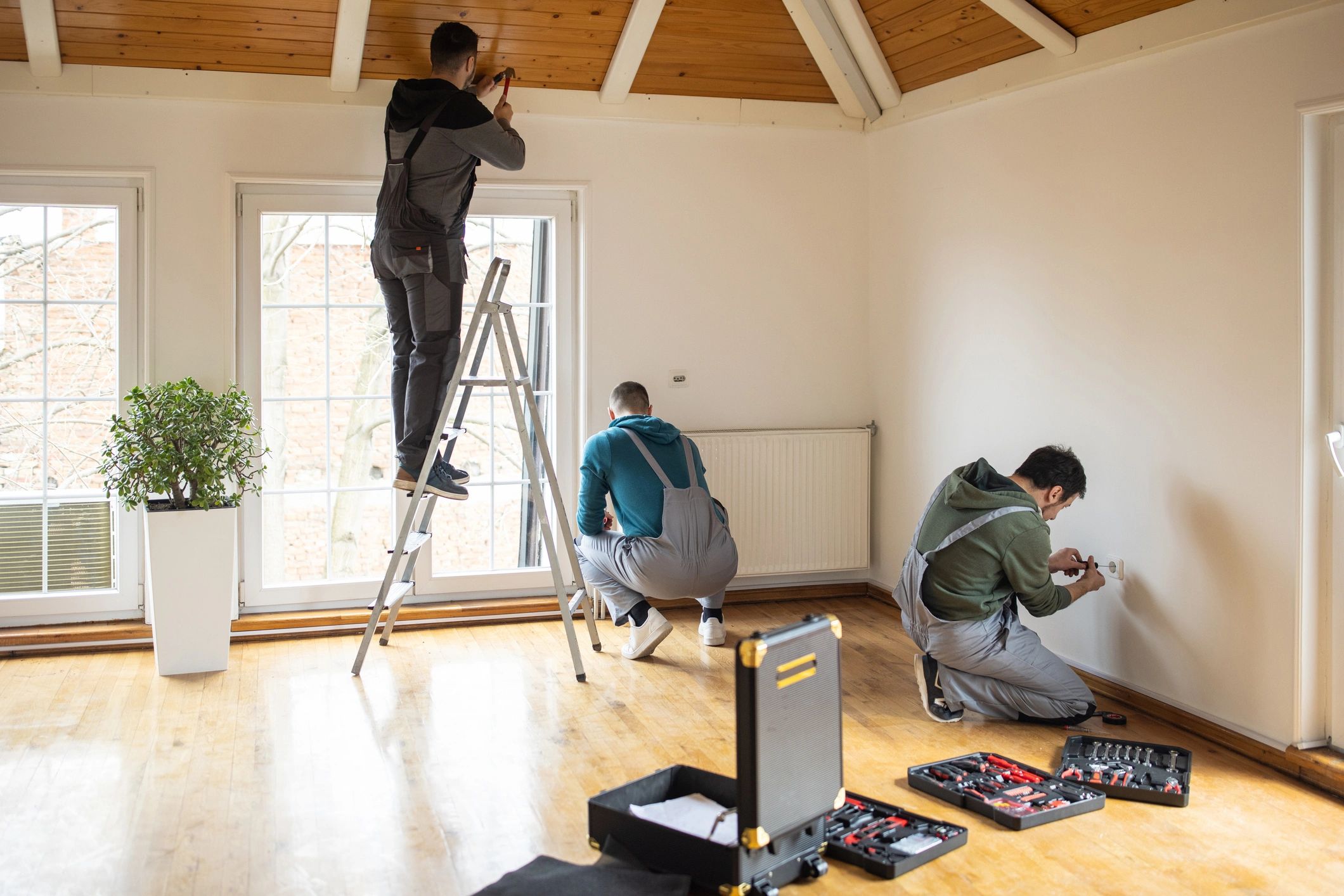 Construction professionals working together inside a home